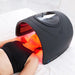 Face and shoulder session with the Galaxy Zero Trinty Red Light Therapy Device positioned over a reclining woman
