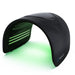 Green LED rows illuminated under the arch of the Galaxy Zero Trinty LED Light Therapy Device on a white background