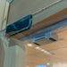 Chrome clamp and magnetic catch at the top of the glass door on the Blisspod Bergen Full Spectrum Sauna