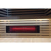 Illuminated red glass heater glowing behind its perforated grille inside the Blisspod Bergen Full Spectrum Sauna