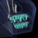 Cutaway of a foot over six teal reflexology rollers in the Infinity Aura Elite 4D footwell
