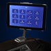 Tablet remote of the Infinity Circadian Syner-D showing twelve auto programs on its 8 inch touch display
