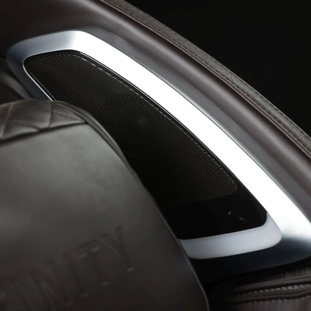 Chrome-framed headrest speaker grille of the Infinity Dynasty 4D Massage Chair in brown leather