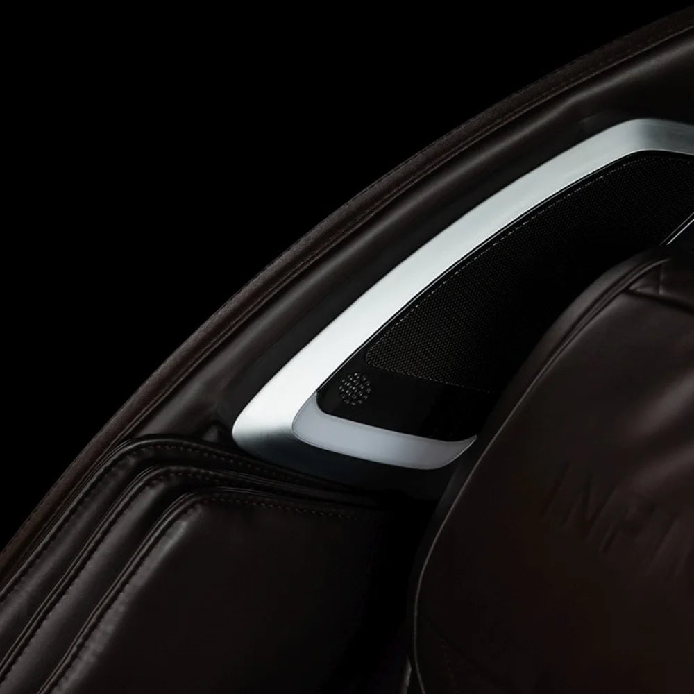 Chrome-trimmed mesh air ionizer panel on the brown leather shoulder of the Infinity Dynasty 4D
