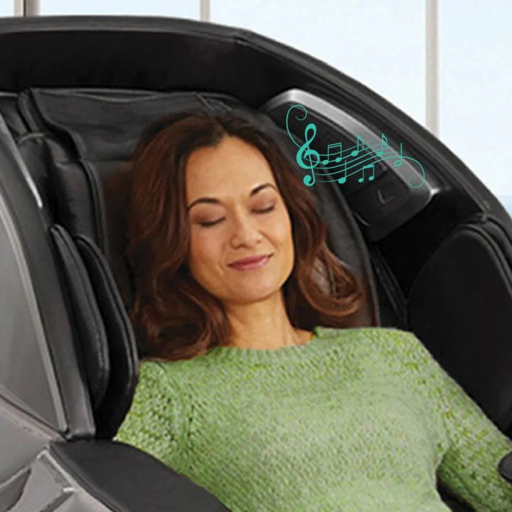 Woman resting on the headrest with music notes beside the speaker of the Infinity Massage Chairs Gen Max 4D Massage Chair
