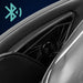 Speaker grille in the leather headrest wing of the Infinity Aura Elite with a teal Bluetooth symbol