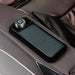Armrest power dial and wireless charging slot on the Infinity Palisade 4D Max Massage Chair in brown leather