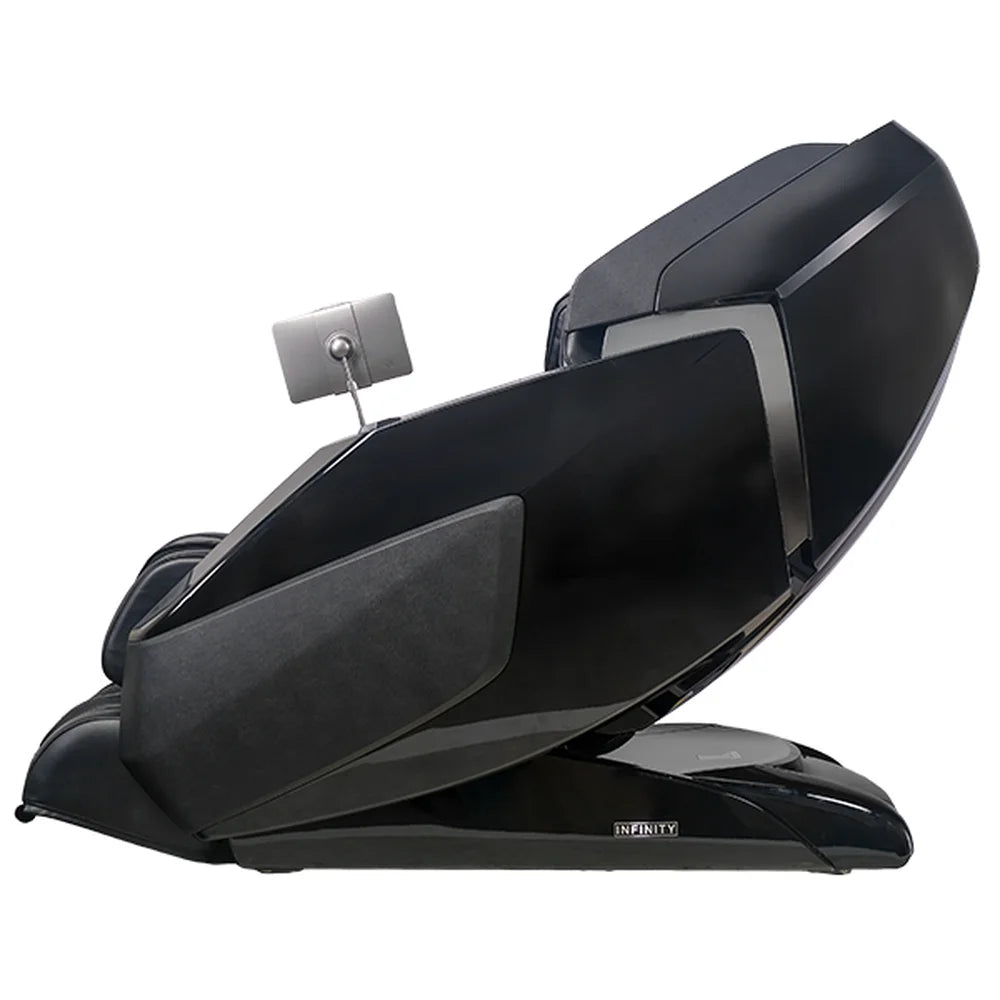 Left profile of the Infinity Ultra Imperial Chair in black showing glossy shell, suede side panel and tablet arm