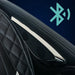 Perforated speaker grille beside quilted headrest stitching on the Infinity Sovana 4D DualPro Massage Chair