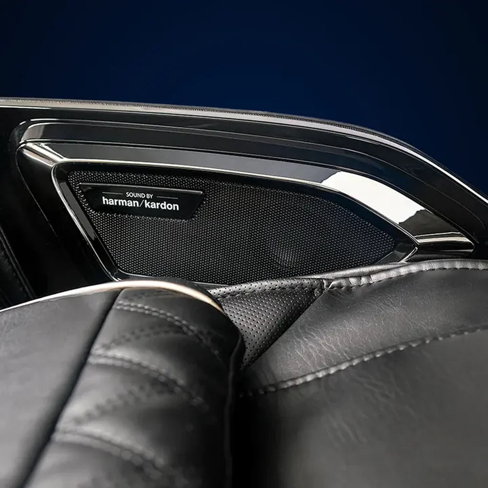 Harman/Kardon badged headrest speaker grille with chrome trim on the Infinity Ultra Imperial Massage Chair