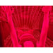 User lying inside the closed Kore KoreKapsule Red Light Therapy Wraps with arms raised toward the glowing LED ceiling