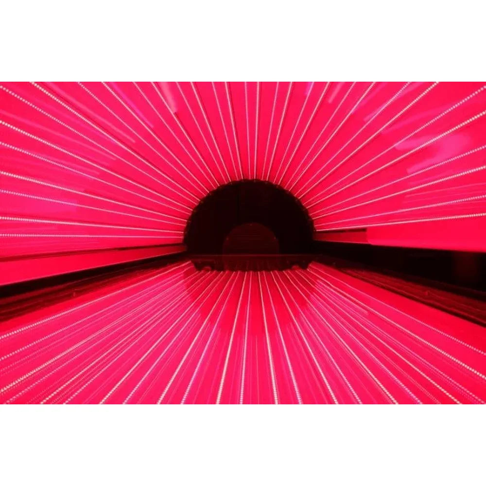 Rows of glowing red LEDs lining the inside of Kore ELITE Red Light Therapy Systems from canopy to bed panel