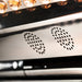 Perforated vent panel and glowing amber LED lenses inside the Galaxy Zero Atlas Full Body LED Therapy panel