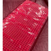 Lit panel of the Kore KoreKapsule Full Body Red Light Therapy Device laid flat on a tiled floor with an even LED grid