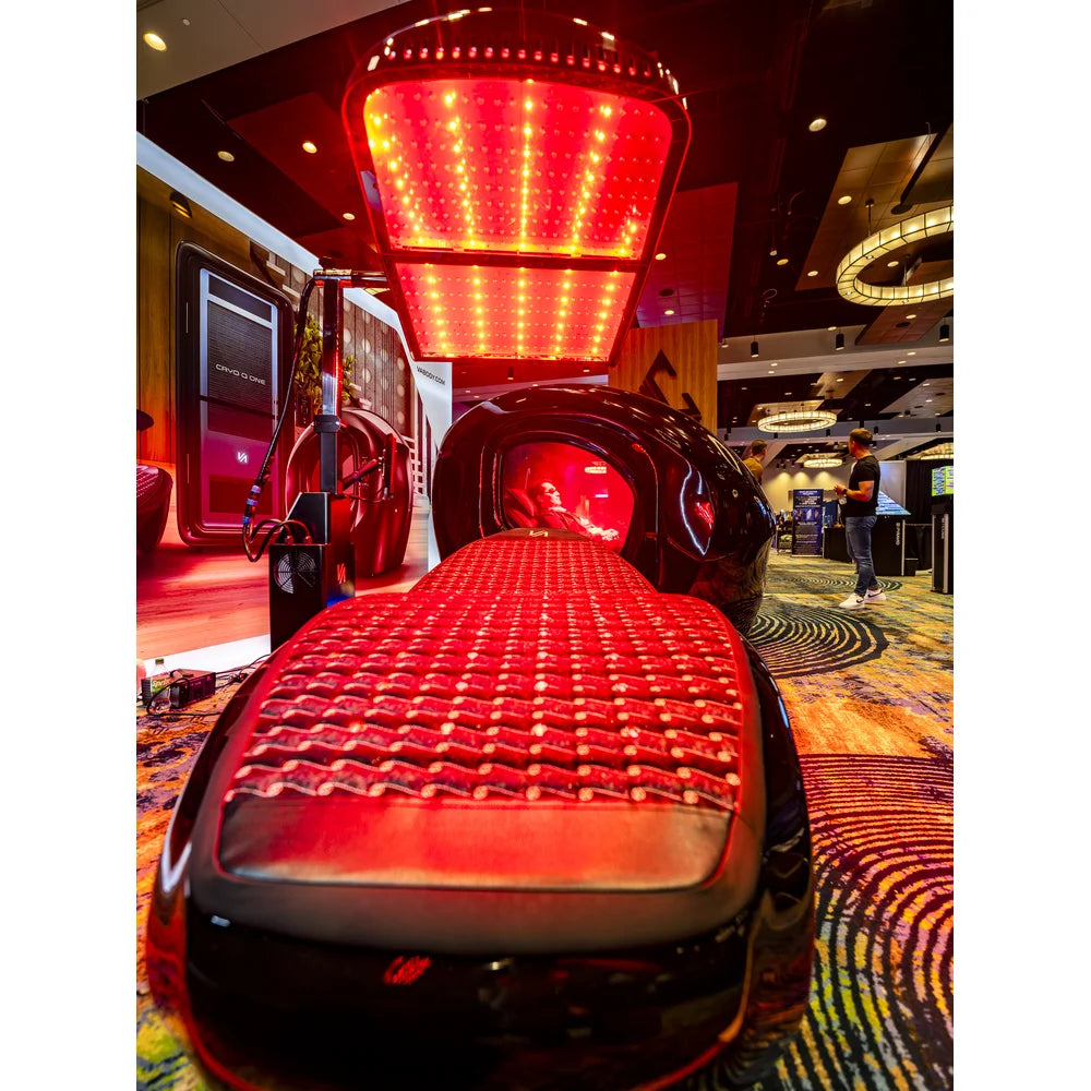 Low foot-end photo of the Tsb360 Longevity Bed Therapy & Recovery Bed with canopy panel lit over the pad
