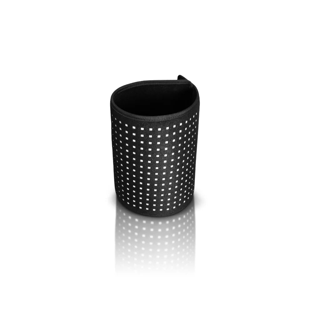 Small square Lumara Pad Red Light Therapy Device curled into a cylinder on white to show how it wraps a limb