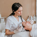 Esthetician treating a client in a med spa room of the kind served by the Lumara Systems PRO Light Therapy Panel