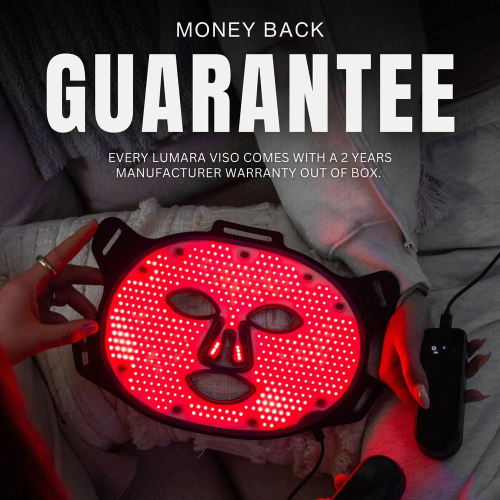 Hands holding a lit Lumara VISO Face Mask under money back guarantee and two year warranty text