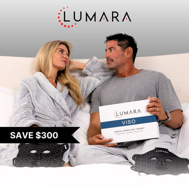 Couple in bed with a Lumara VISO Red Light Therapy Mask box and two masks in a save $300 promo