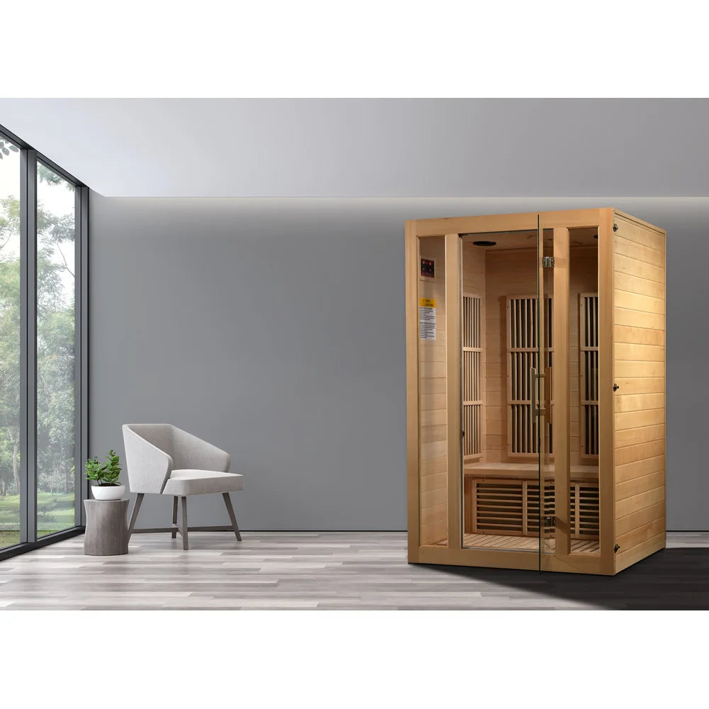 Hemlock Maxxus Seattle 2 Person Sauna placed in a modern room with armchair, plant and large window