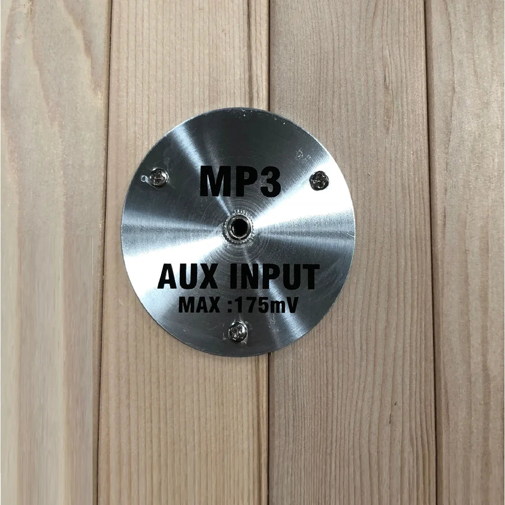 Brushed metal MP3 aux input plate with 3.5mm jack on the wood wall of the Maxxus Bellevue Infrared Sauna Cabinet
