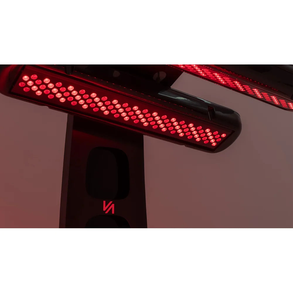 Close-up of the lit LED array in an overhead lamp head on the Vacu Activ Red Couch 360 Red Light Therapy Couch