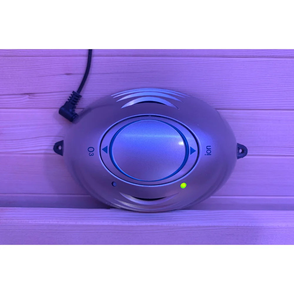 Wall-mounted O3 and ion air purifier dial glowing inside the Blisspod Helsinki Sauna Pod cabin