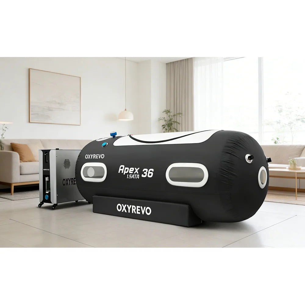 Black OxyRevo Apex36 1.5ATA Chamber beside the all-in-one Pro Kit machine cabinet in a living room