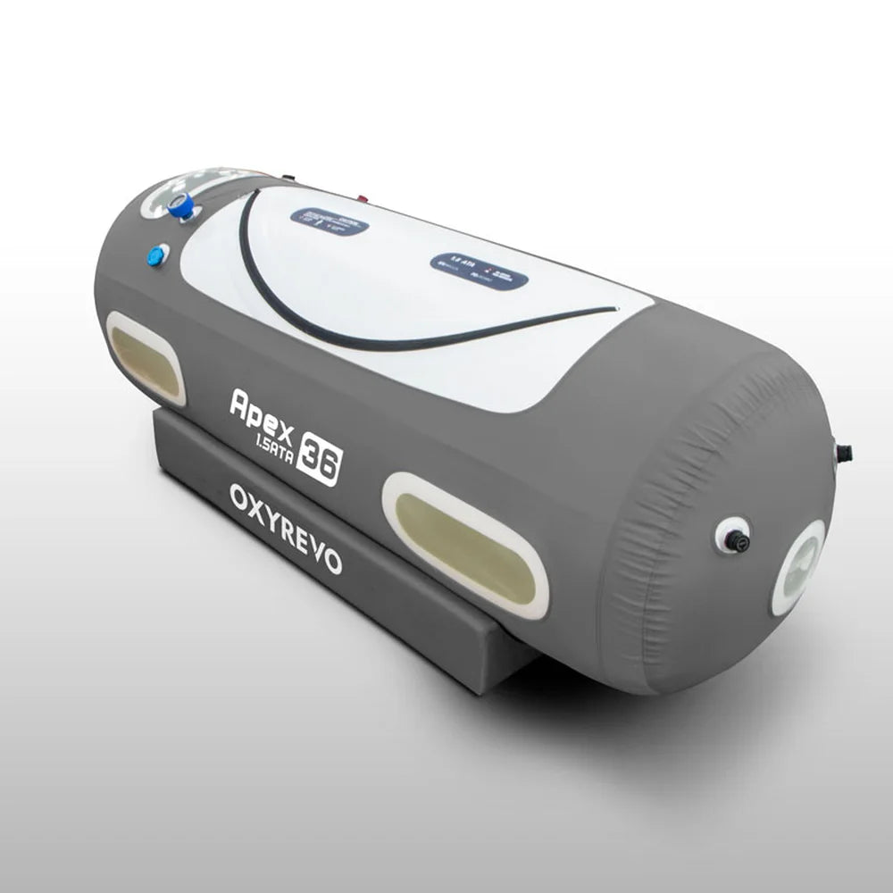 Angled studio view of the inflated OxyRevo Apex36 1.5ATA Chamber showing curved zipper, windows and base