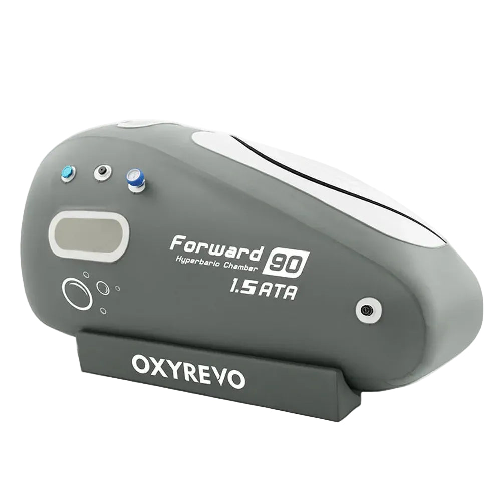 Angled front studio view of the grey 1.5 ATA Oxyrevo Forward90 Oxygen Chamber with white top panel and window
