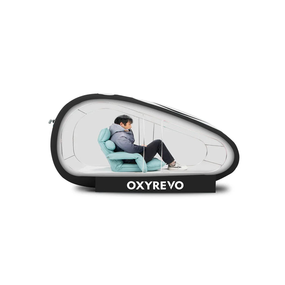Cutaway of a man sitting upright on the folding chair inside the Oxyrevo Forward90 with headroom above