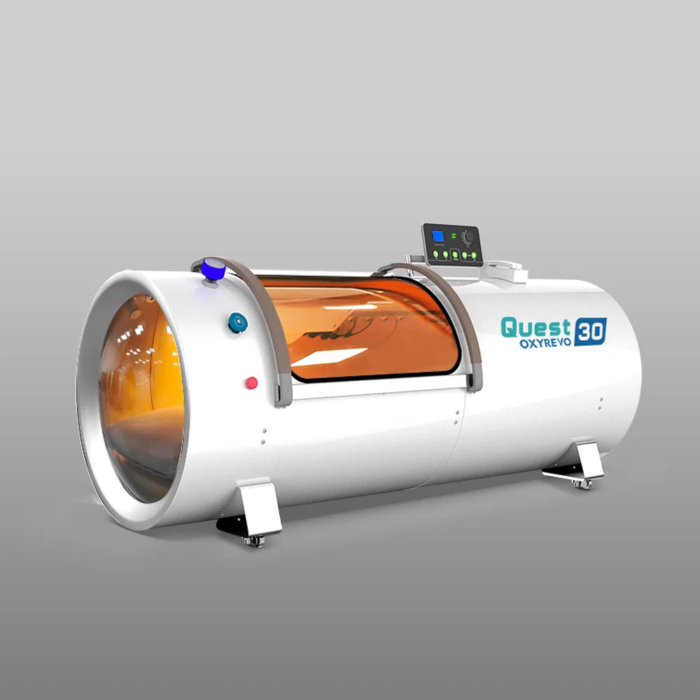 Angled studio view of the white OxyRevo Quest30 Oxygen Chamber showing round end window, side door and top controls
