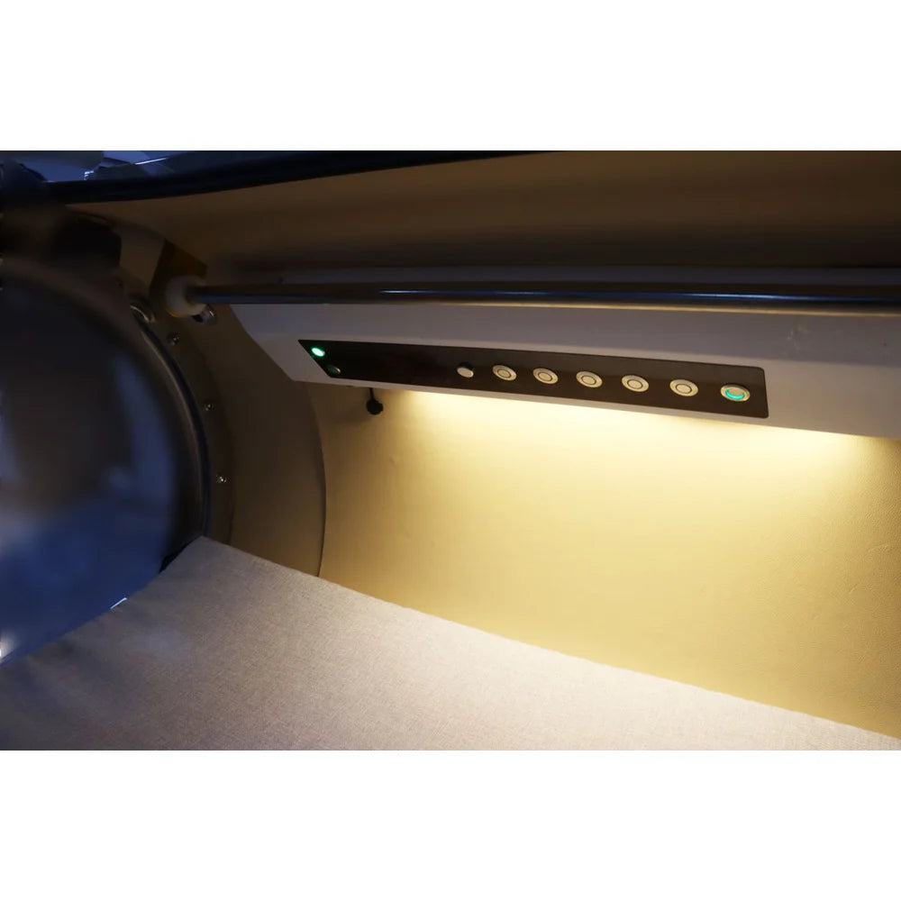 Warm LED reading light and inside button panel along the padded wall of the OxyRevo Quest30 Hard Hyperbaric Chamber