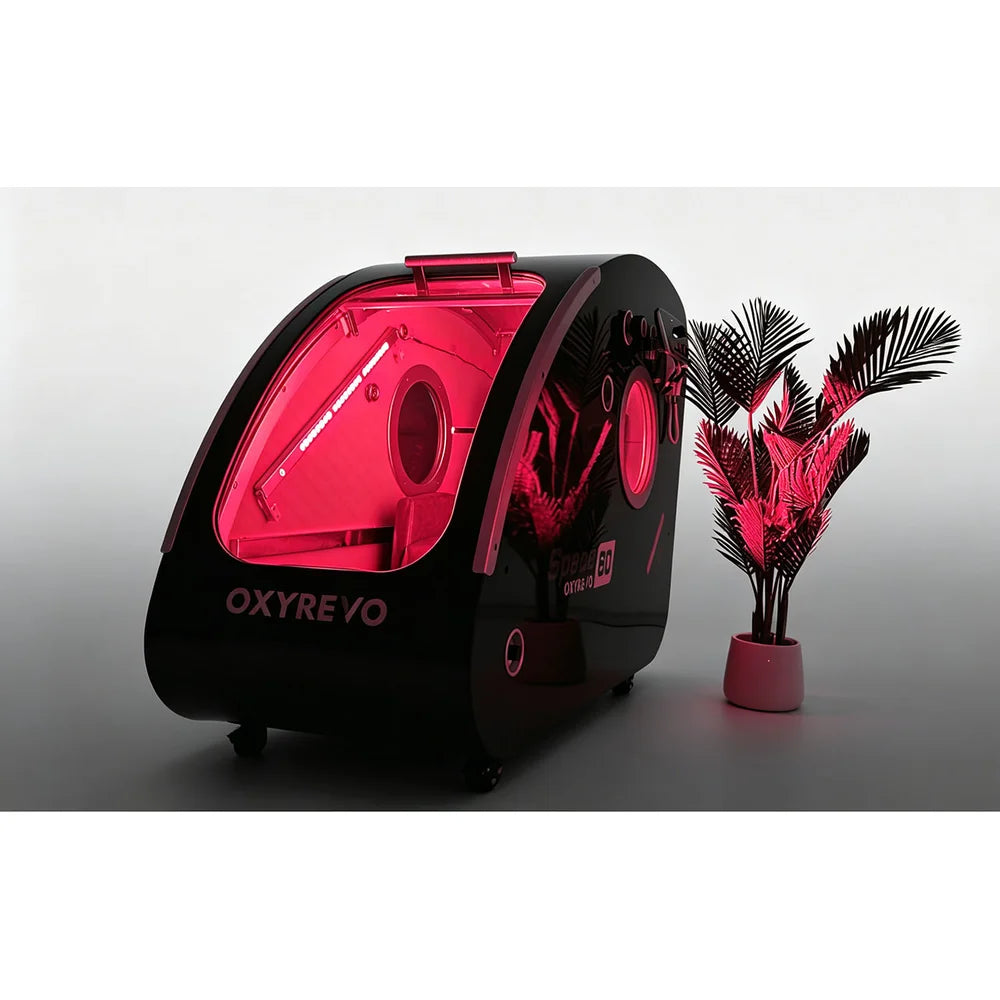 Black hard shell Space60 with red therapy lighting filling the cabin, the OxyRevo Space60 Hyperbaric Chamber