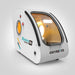 Reverse angle of the white OxyRevo Space60 Hyperbaric Chamber showing the lit interior through the door glazing