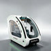 White OXYREVO Space60 Pro Oxygen Chamber with green perimeter lighting and grey leather seat in the cabin