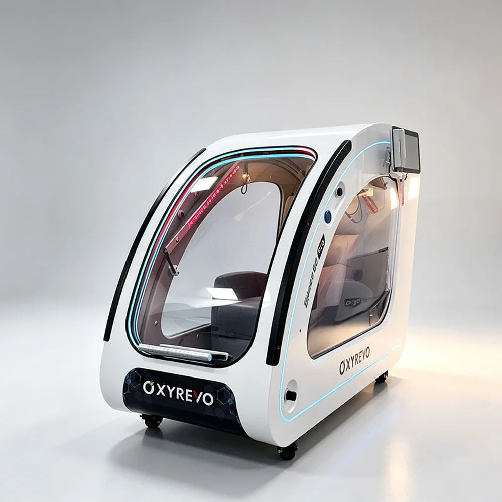 Rear quarter view of the white OXYREVO Space60 Pro Oxygen Chamber showing the clear door and touch screen