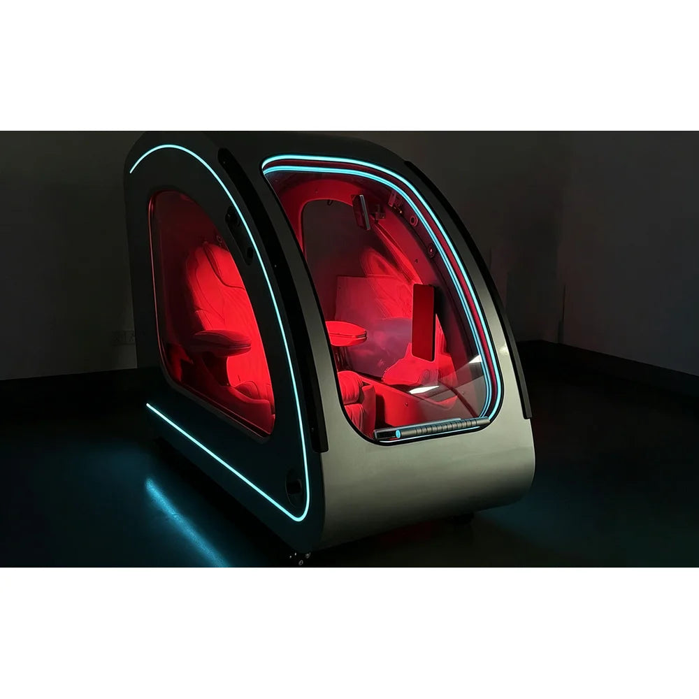 Silver OXYREVO Space60 Pro photographed in a dark room with cyan trim and deep red cabin illumination