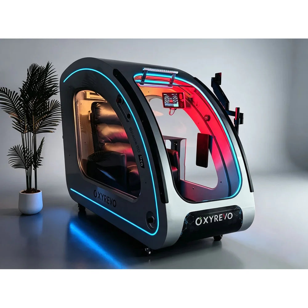 Open-door silver OXYREVO Space60 Pro Hyperbaric Chamber with blue trim lighting and a palm plant beside it