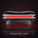 Black Peak Muscle Recovery Basecamp Red Light Therapy Bed with red LEDs glowing in a dark studio