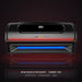 Black Peak Muscle Recovery Summit 360 Red Light Therapy Bed with red LEDs glowing in a dark studio