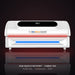White Peak Muscle Recovery Summit 360 Red Light Therapy Bed with red LEDs glowing in a dark studio