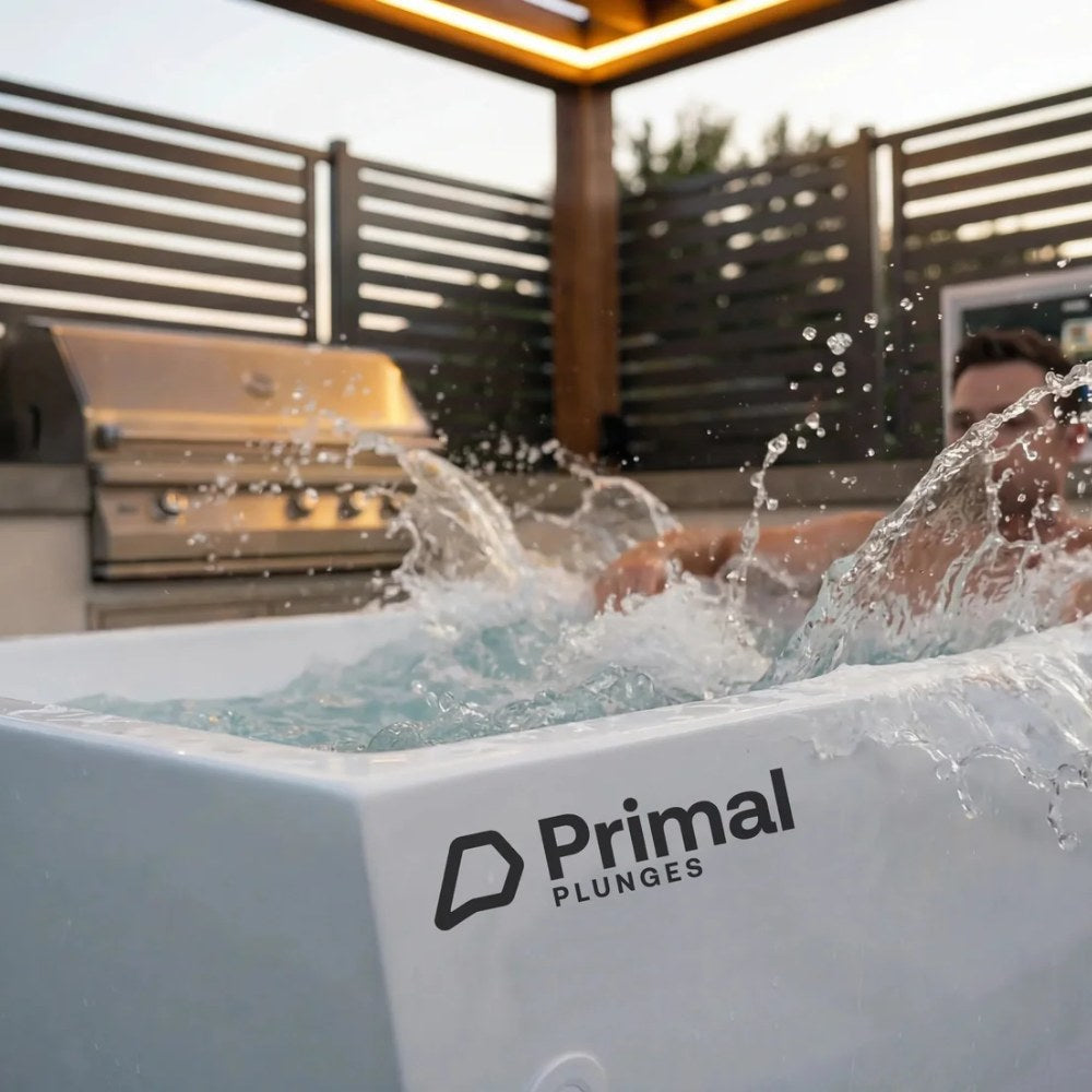 Man splashing water in the Primal Plunges Blizzard cold plunge