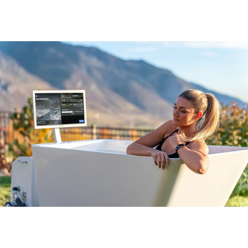 Woman relaxing in the Primal Plunges Whiteout angled cold plunge