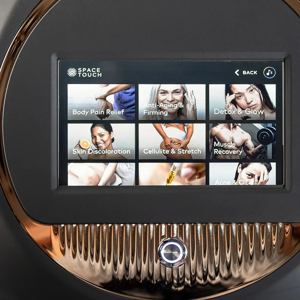 Touchscreen menu listing treatment programs such as Detox & Glow and Muscle Recovery on the Galaxy Zero Atlas LED Therapy Device