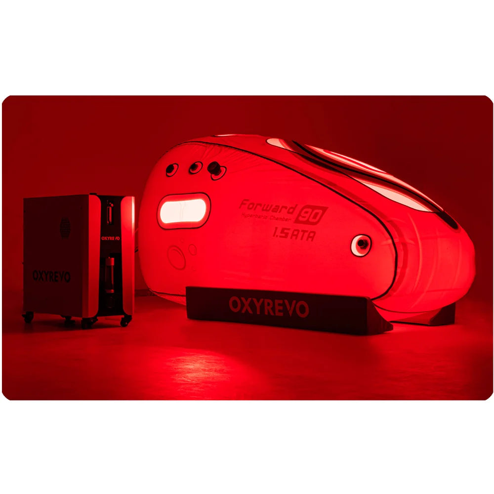 Deep red illumination from the red light therapy panel around the Oxyrevo Forward90 Sitting Hyperbaric Chamber