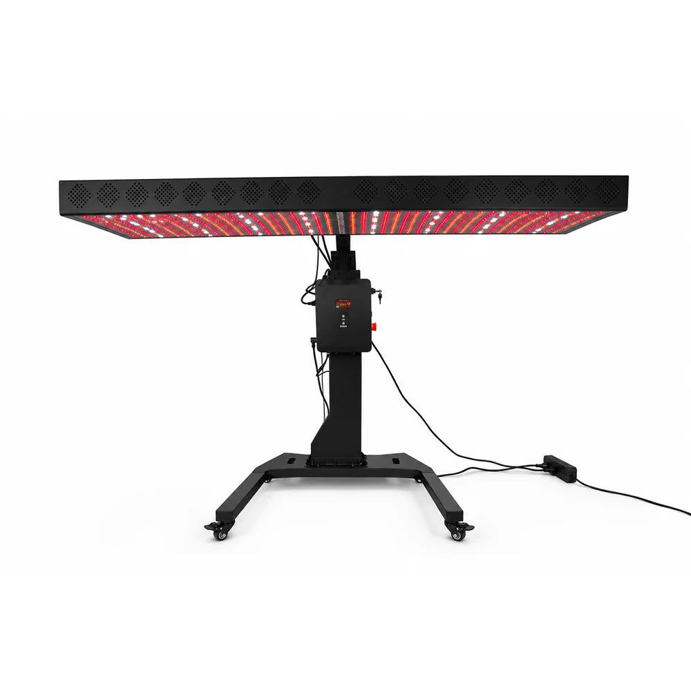 RevitalCore Apex Red Light Therapy Panel tilted flat overhead on its motorized column stand with lit red and white diodes