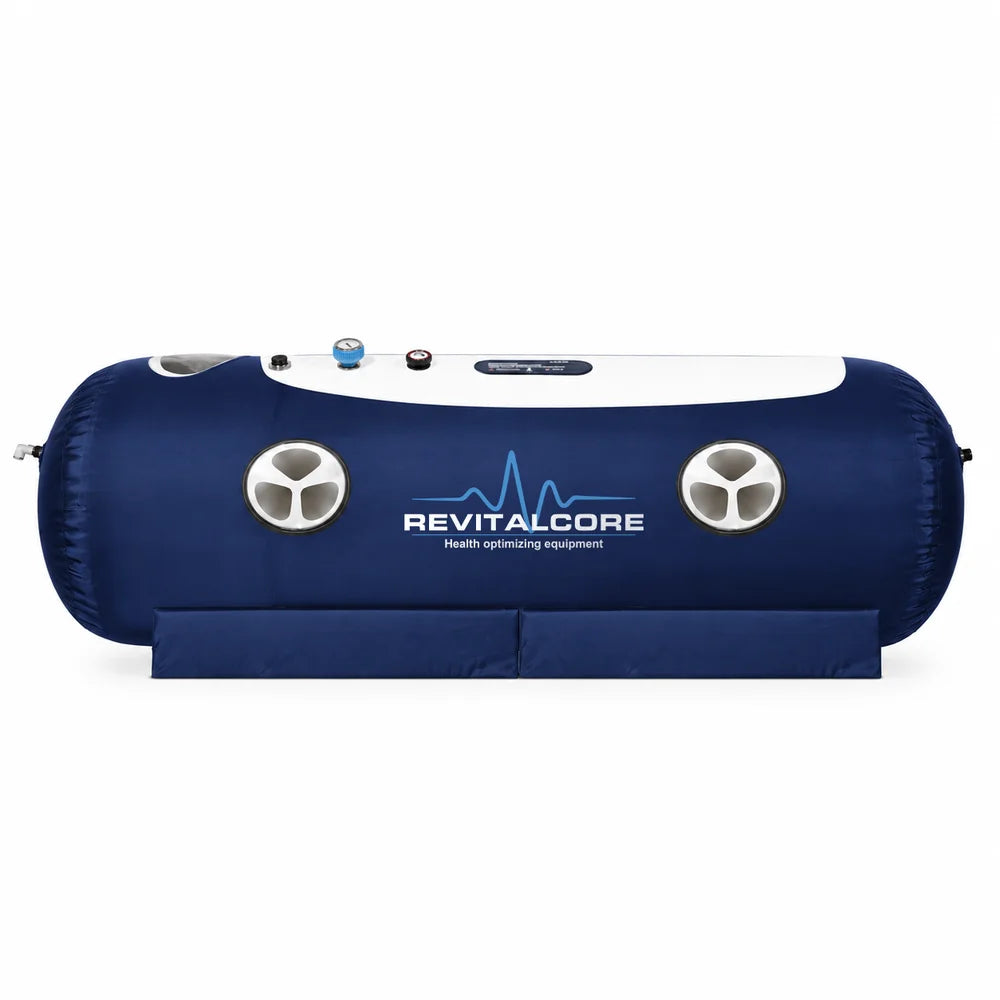 Navy blue inflated RevitalCore Ascent Flex Hyperbaric Chamber with two round windows, top gauge and padded base
