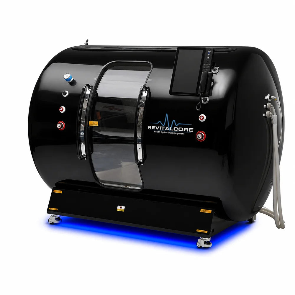 Angled studio shot of the RevitalCore Summit Duo Plus Walk-In Chamber in gloss black with chrome door handles and lit base