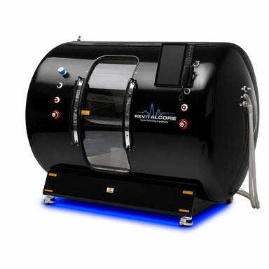 Angled studio shot of the RevitalCore Summit Duo Plus Walk-In Chamber in gloss black with chrome door handles and lit base